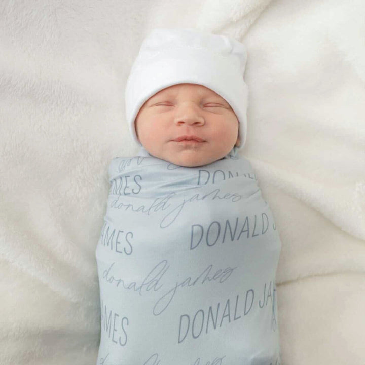 block and script font light blue swaddle