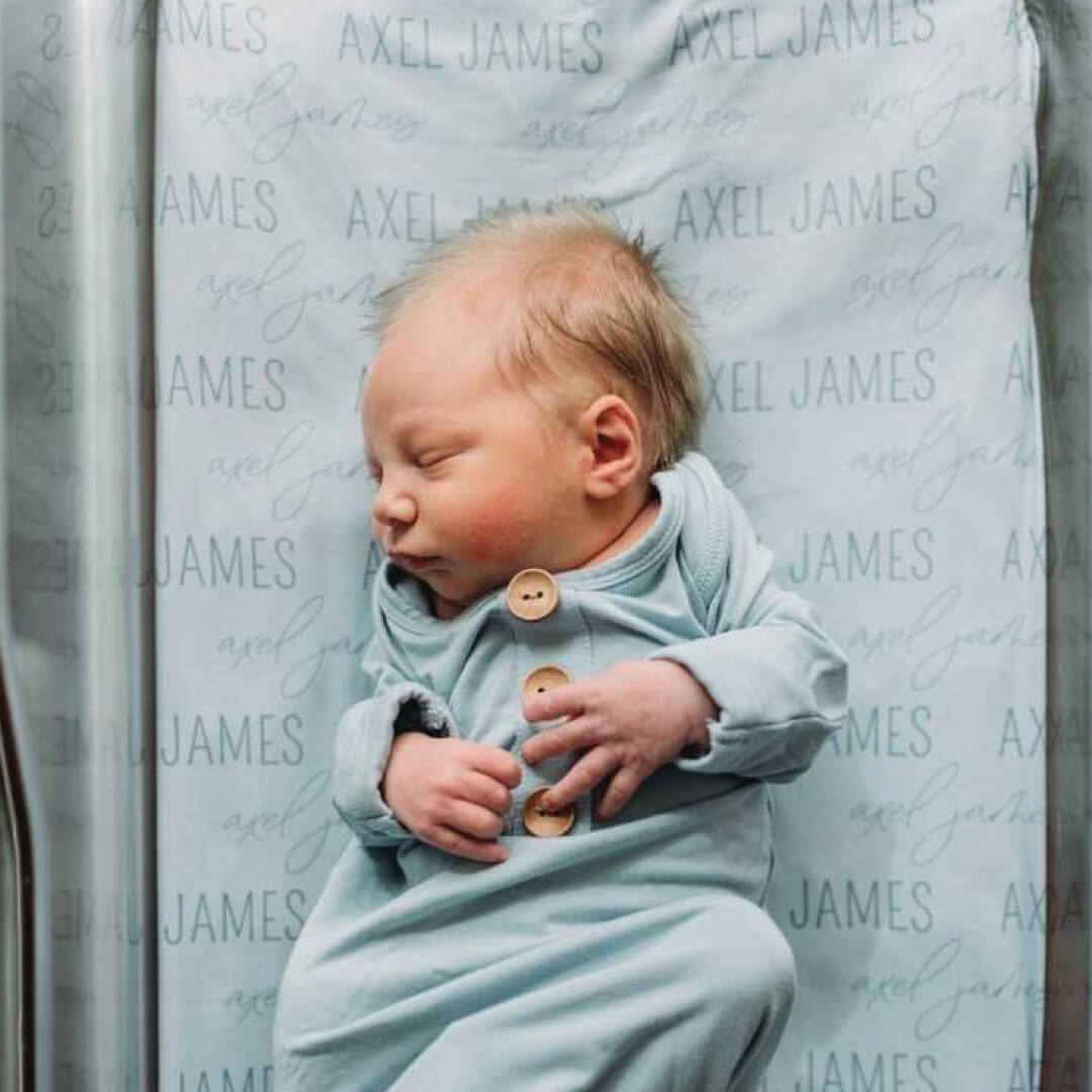 personalized swaddle blanket light blue block and script font 