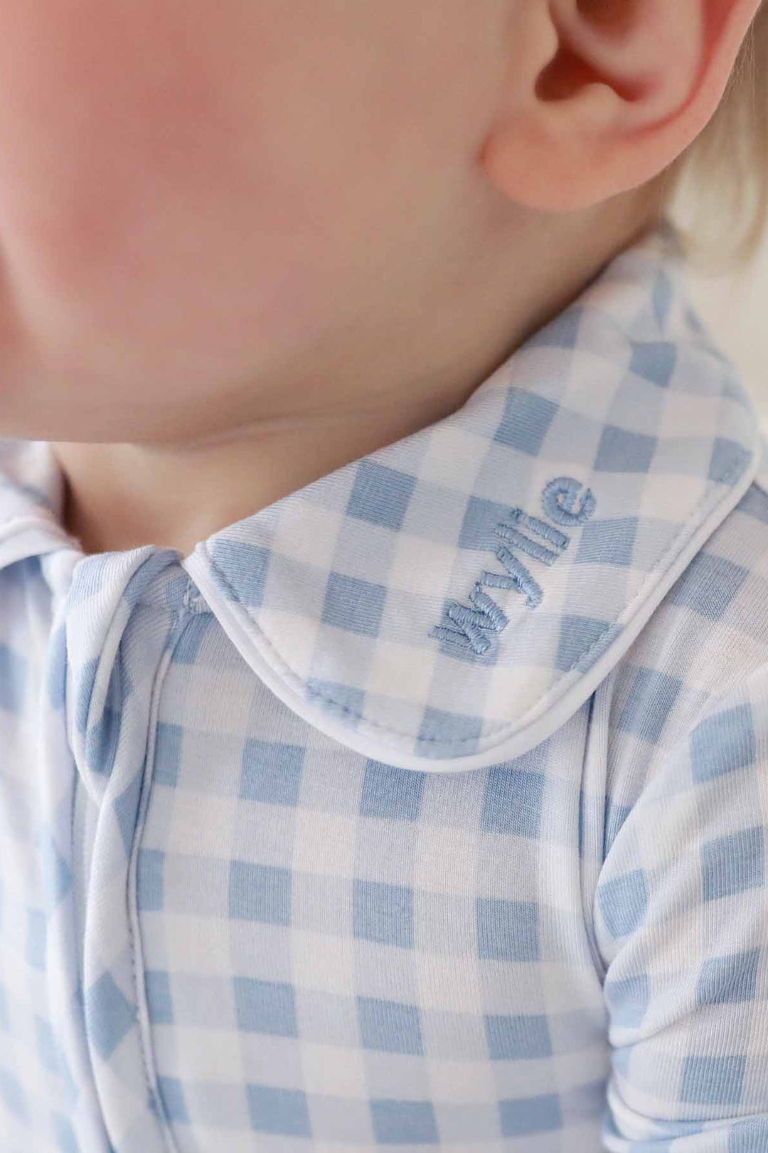 light blue gingham footie with peter pan collar and name embroidery