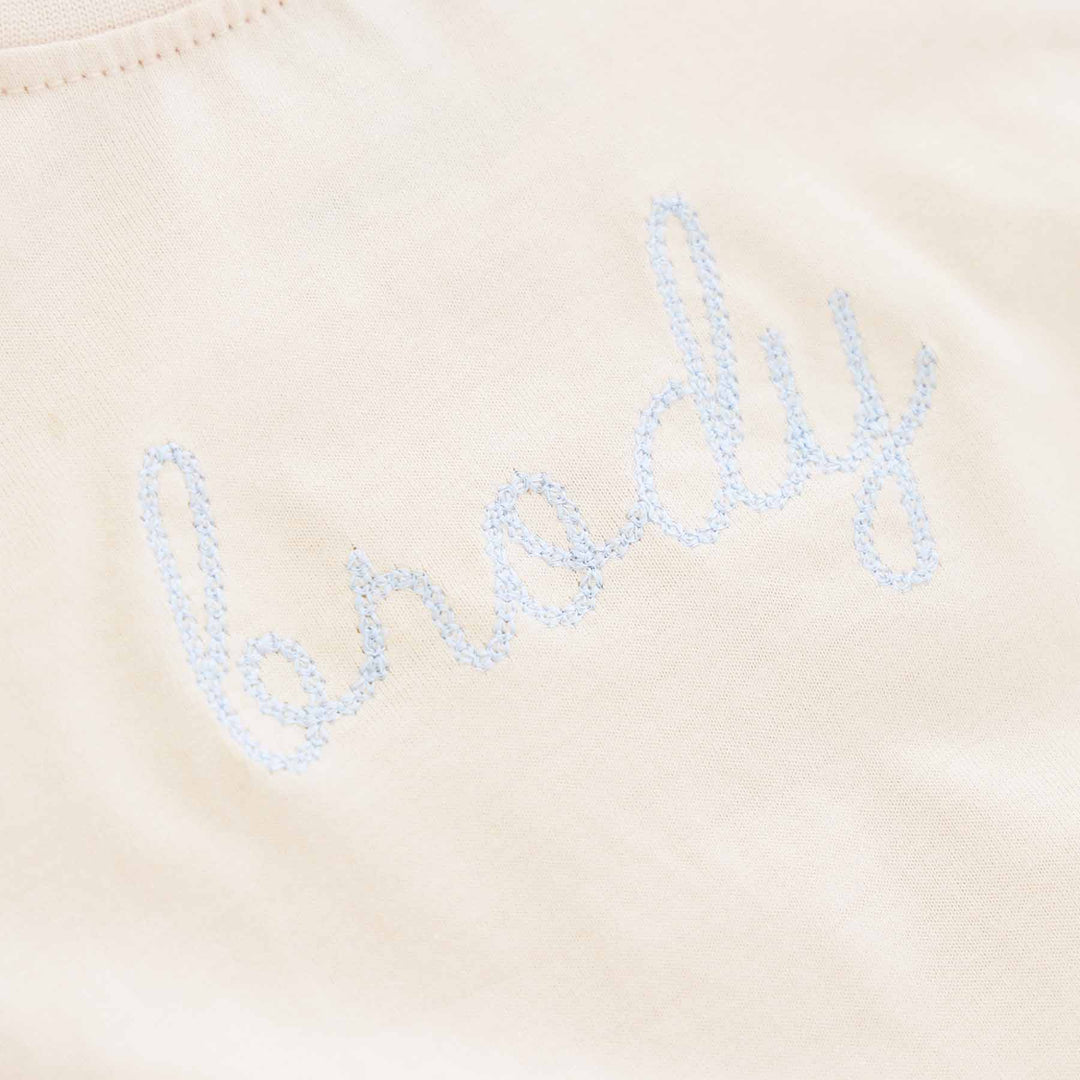light blue thread on natural tan long sleeve bubble romper for babies and toddlers