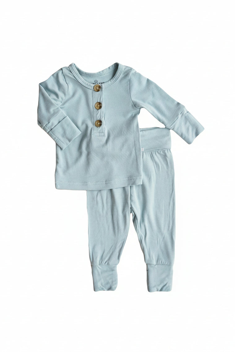 Flat lay of the 2pc Bamboo Button Top & Bottom in the color Ocean. 