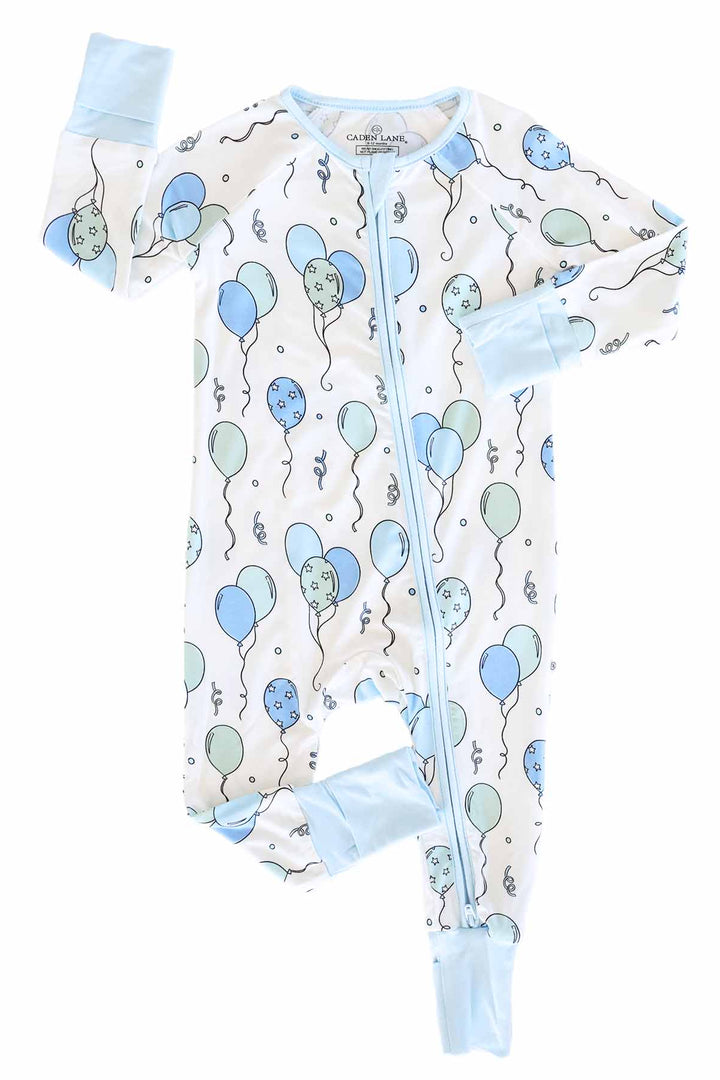 blue and green balloon and streamer convertible zip romper pajama with blue trim for boys 
