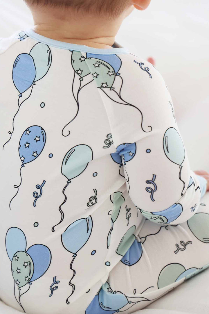 blue and green balloon and streamer bamboo convertible zip romper 