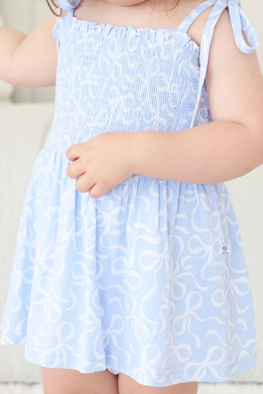 blue-tiful bows smocked bodysuit 