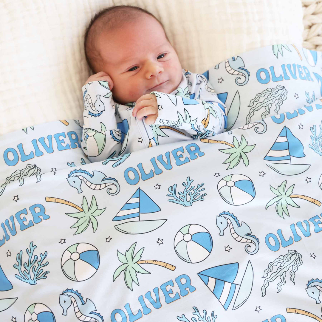 blue tiny tides personalized swaddle blanket for newborn boys 