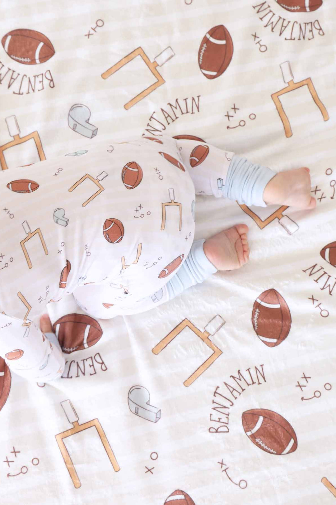 neutral football convertible zip romper made of bamboo viscose 