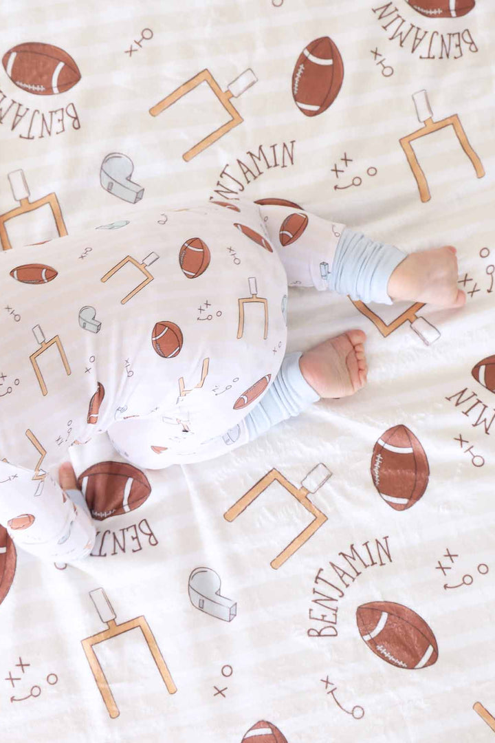 neutral football convertible zip romper made of bamboo viscose 