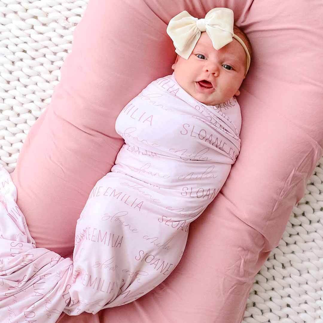 pink personalized baby swaddle blanket block and script 