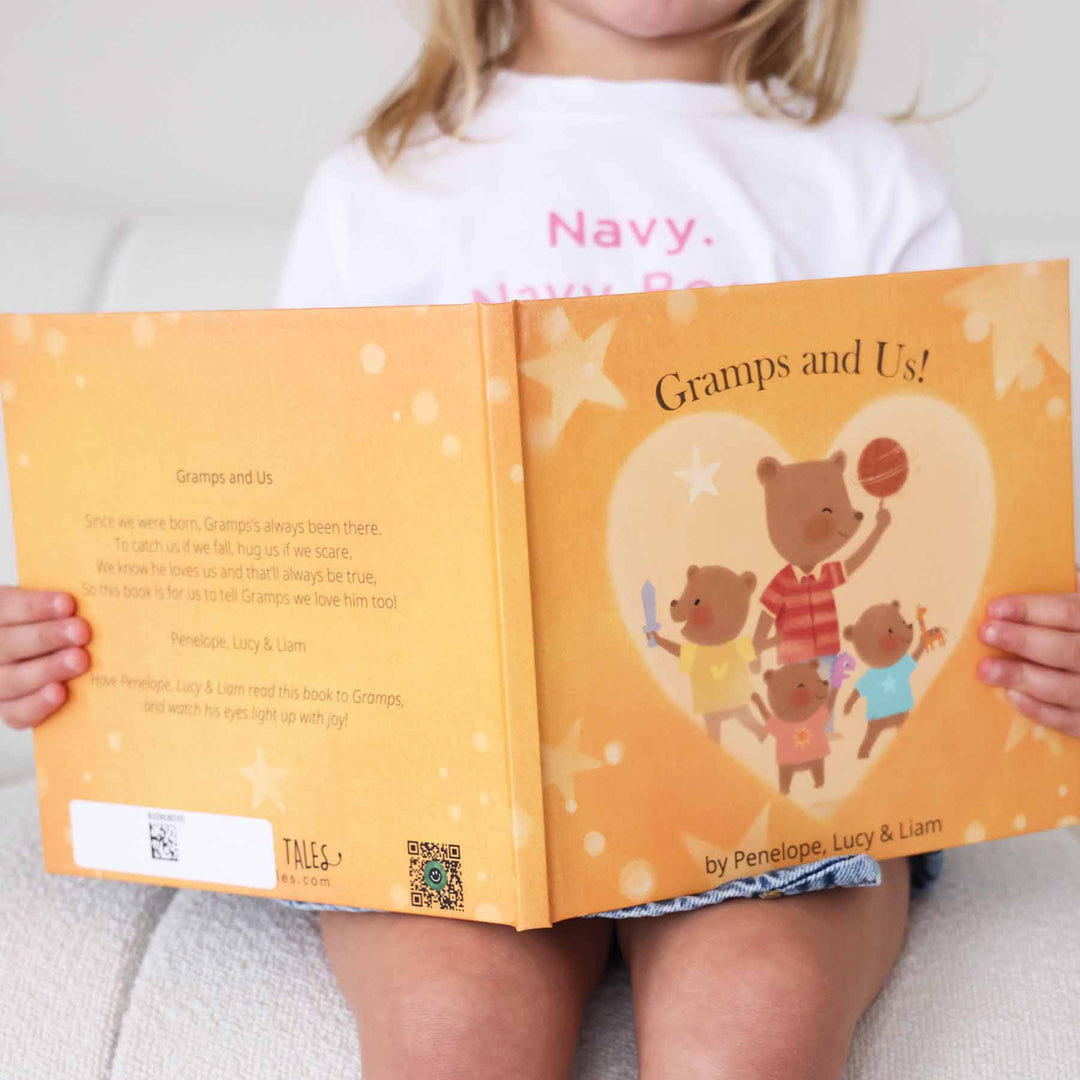 girl with personalized kids books from grandfather