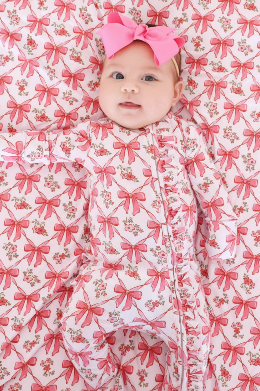 pink bow ruffle footie for babies 