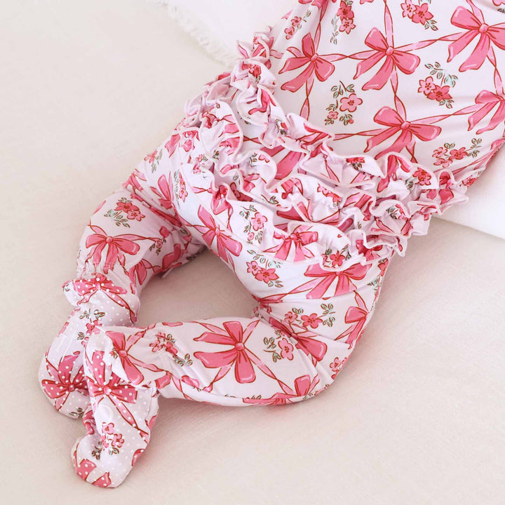 bow baby zipper footie with ruffles on the bottom