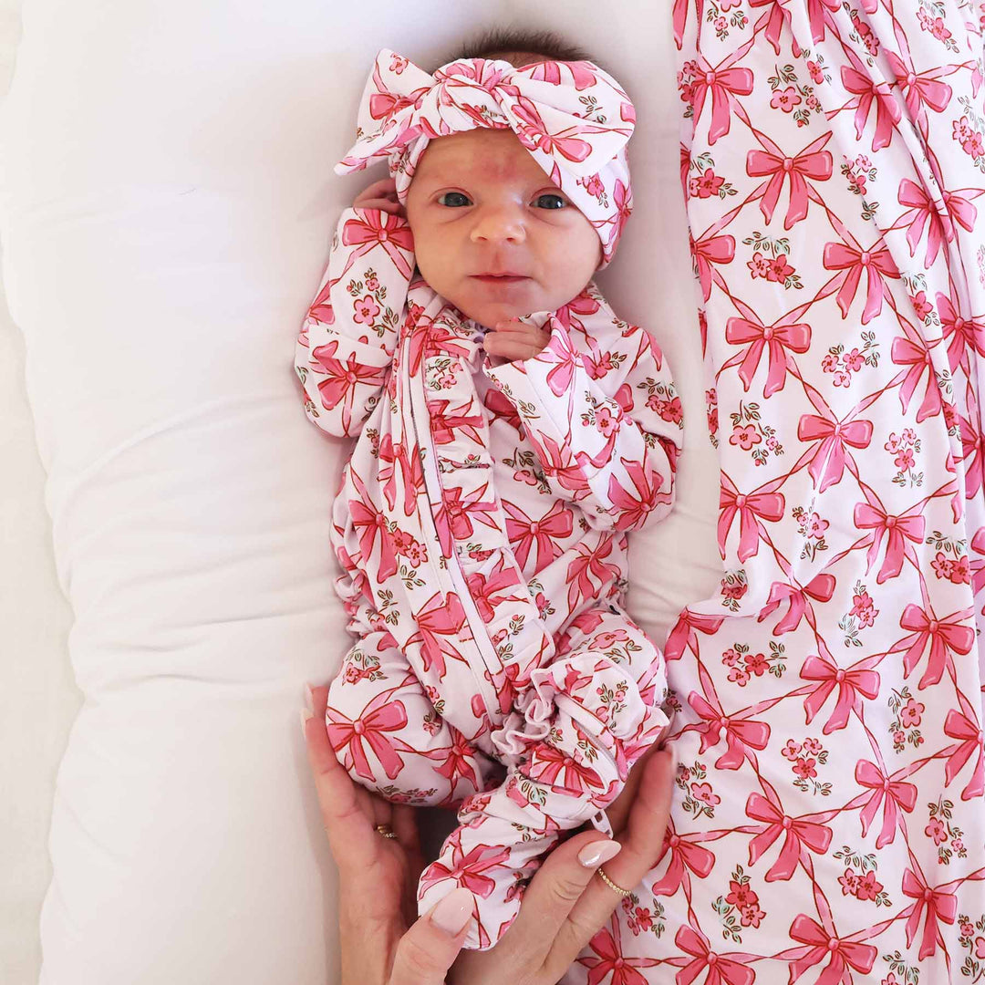 pink bow baby zipper footies with ruffles 