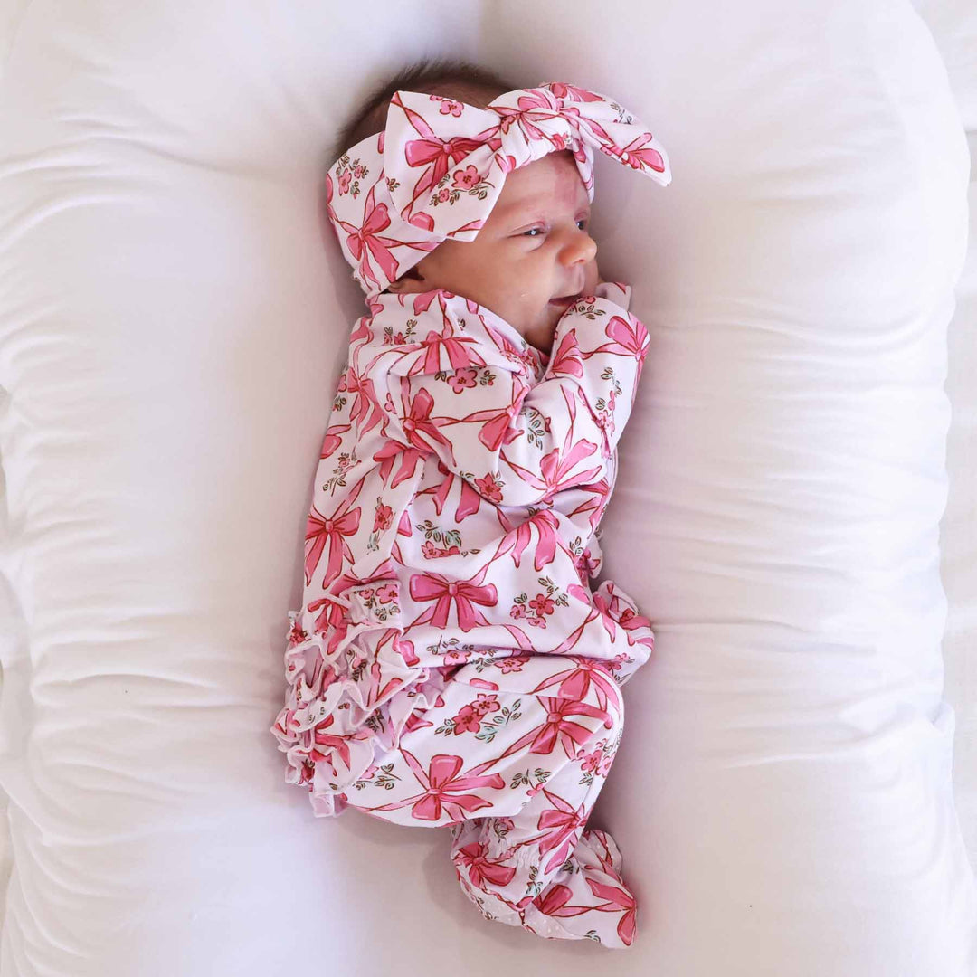 baby girl ruffle zipper footie with pink bows 
