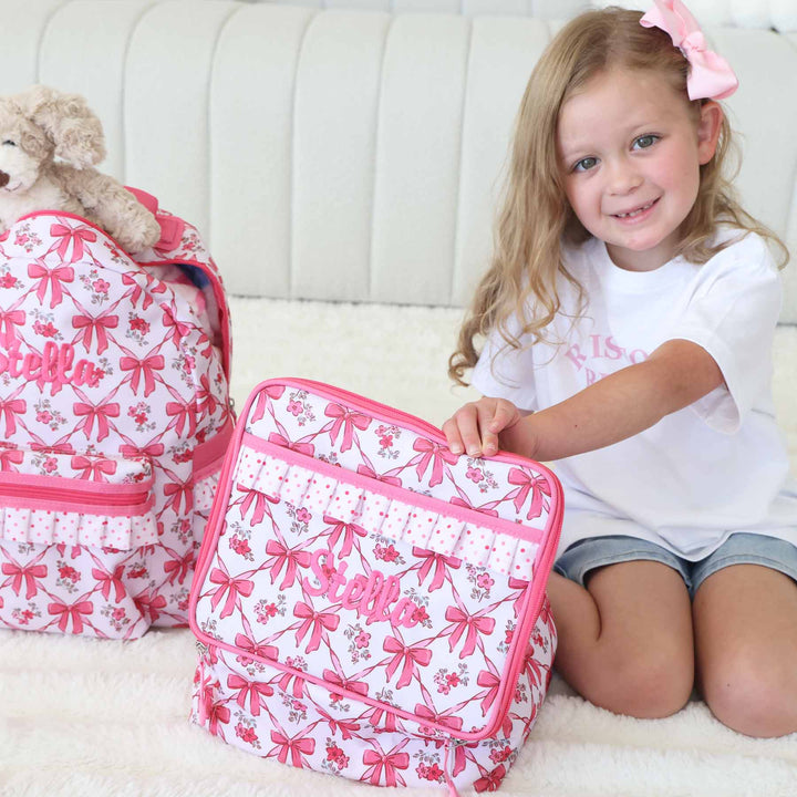 hot pink embroidered name lunch box for girls with bows, flowers and polka dots