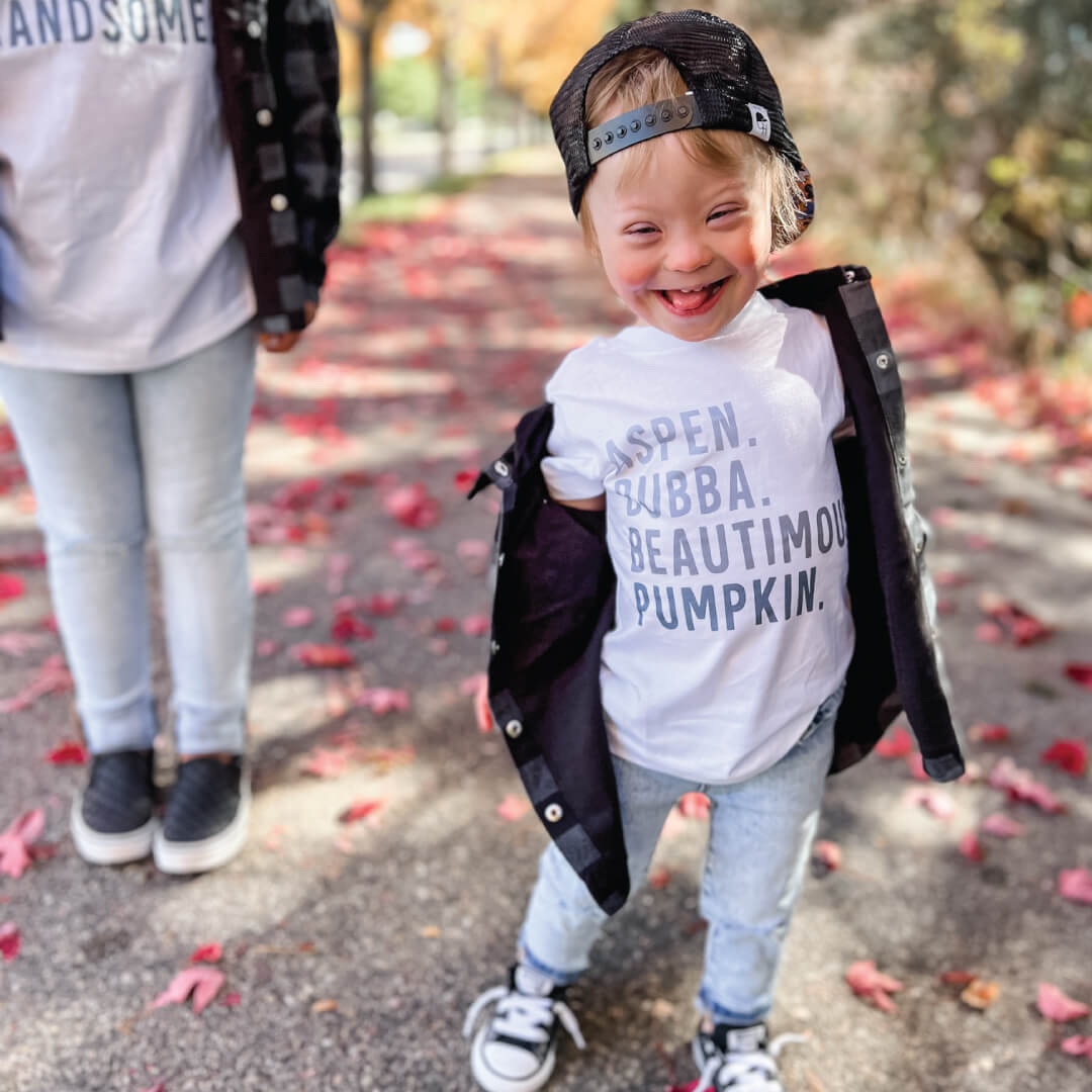 white tshirt with baby nicknames blue font 