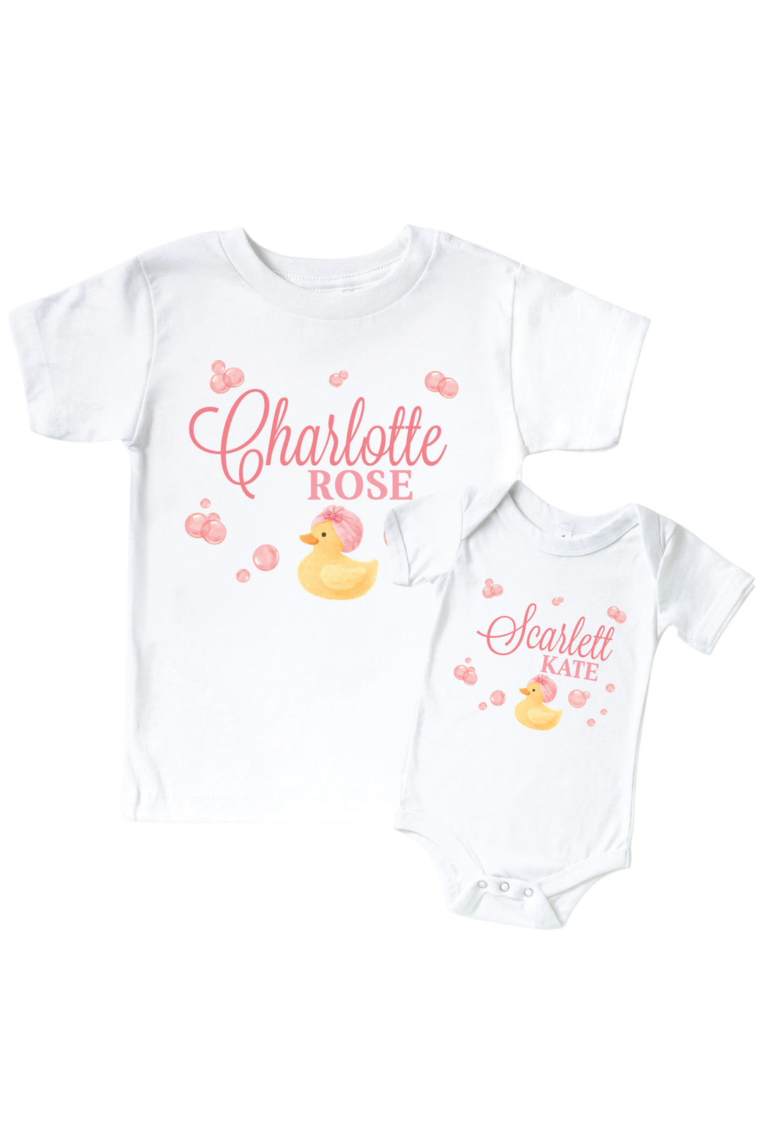 White kids tee and baby bodysuit with personalized pink bubble duckie graphic design featuring yellow rubber duck with pink bubbles and custom name