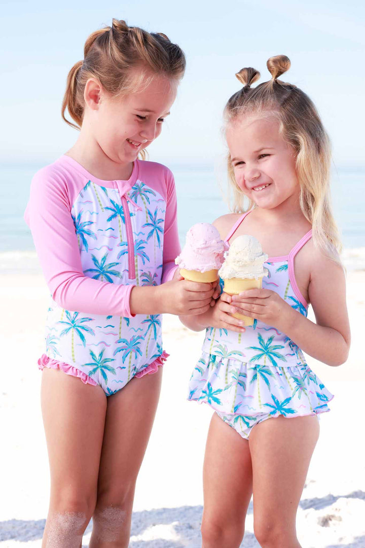 sisters wearing long sleeve rash guard swim romper shortie 
