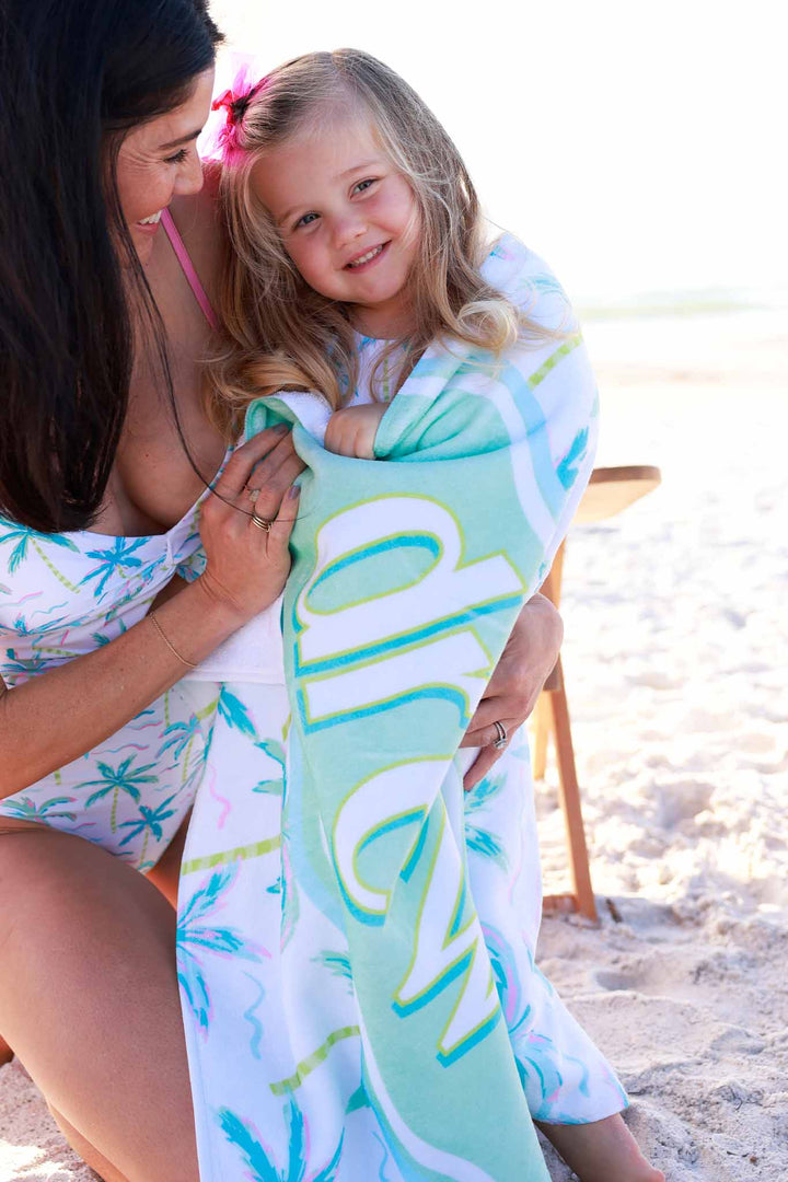 girl wrapped up in blue lagoon personalized beach towel
