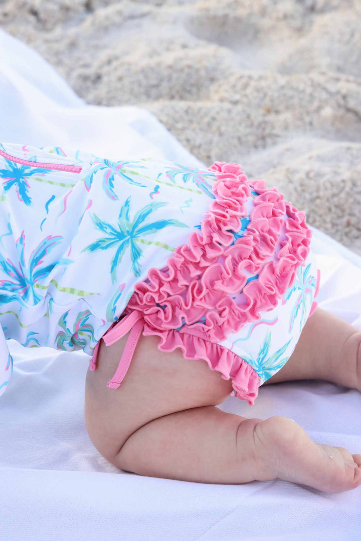 closeup of pink butt ruffles on blue lagoon rash guard 