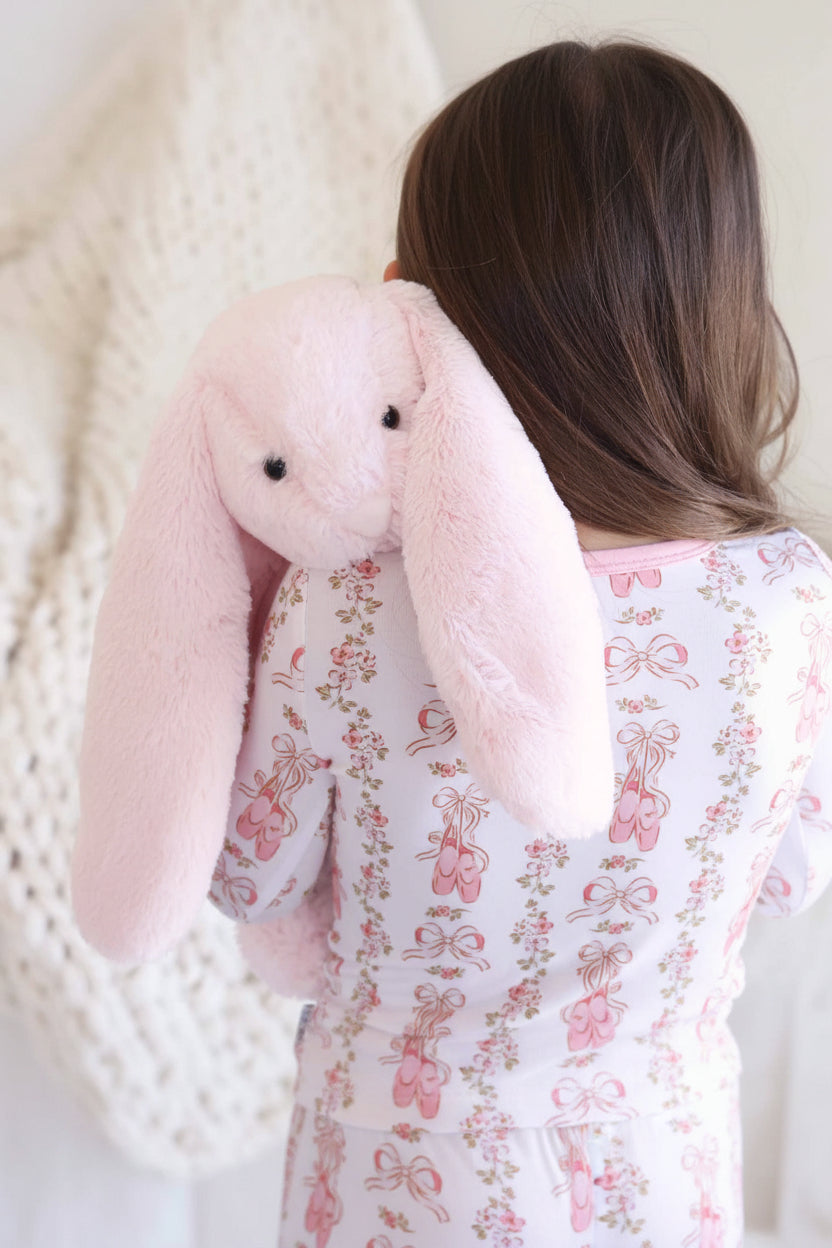 oversized pink bunny stuffed animal with long ears 