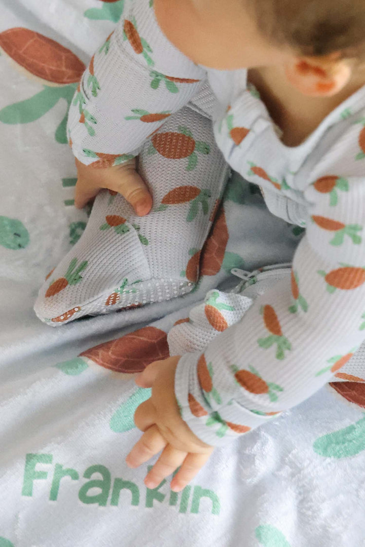 coastal cruisers turtle print footie for babies in bamboo waffle fabric
