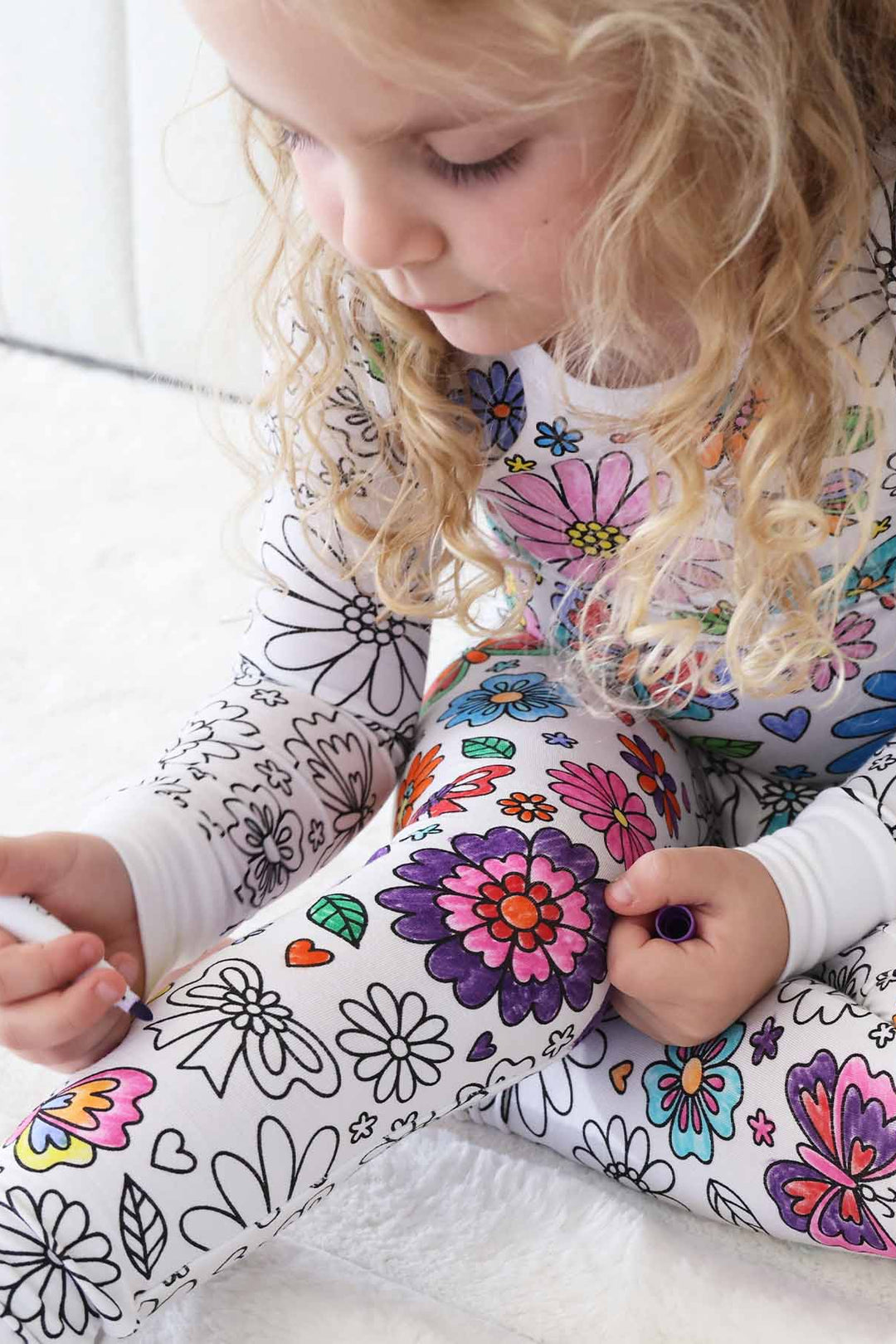 girl wearing the Floral Flutter Colorable Pajama Two Piece Set