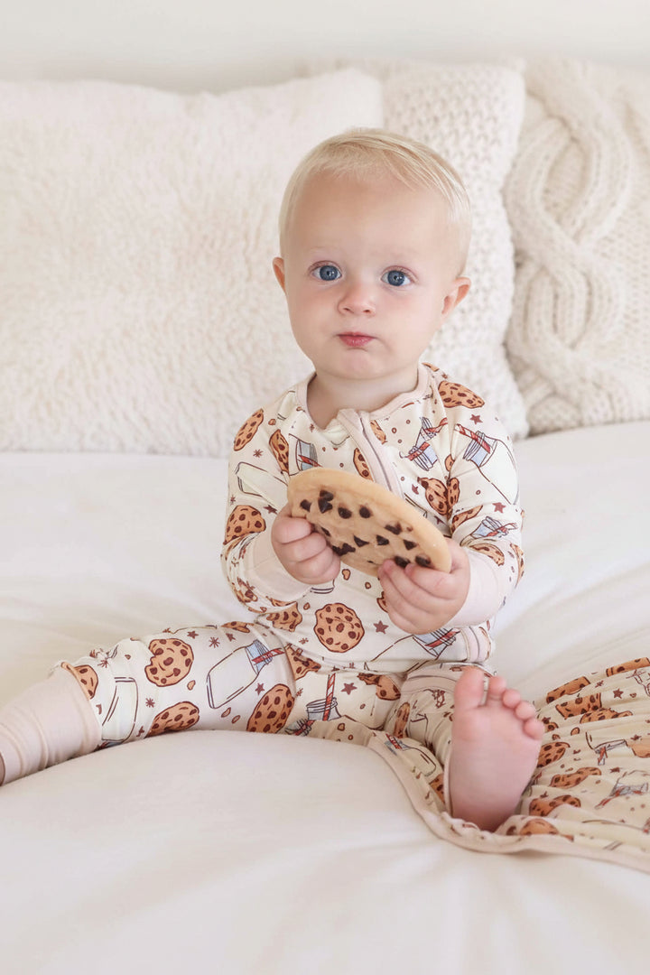 Baby sitting with cookie toy wearing Cookie Cuddles Convertible Zip Romper