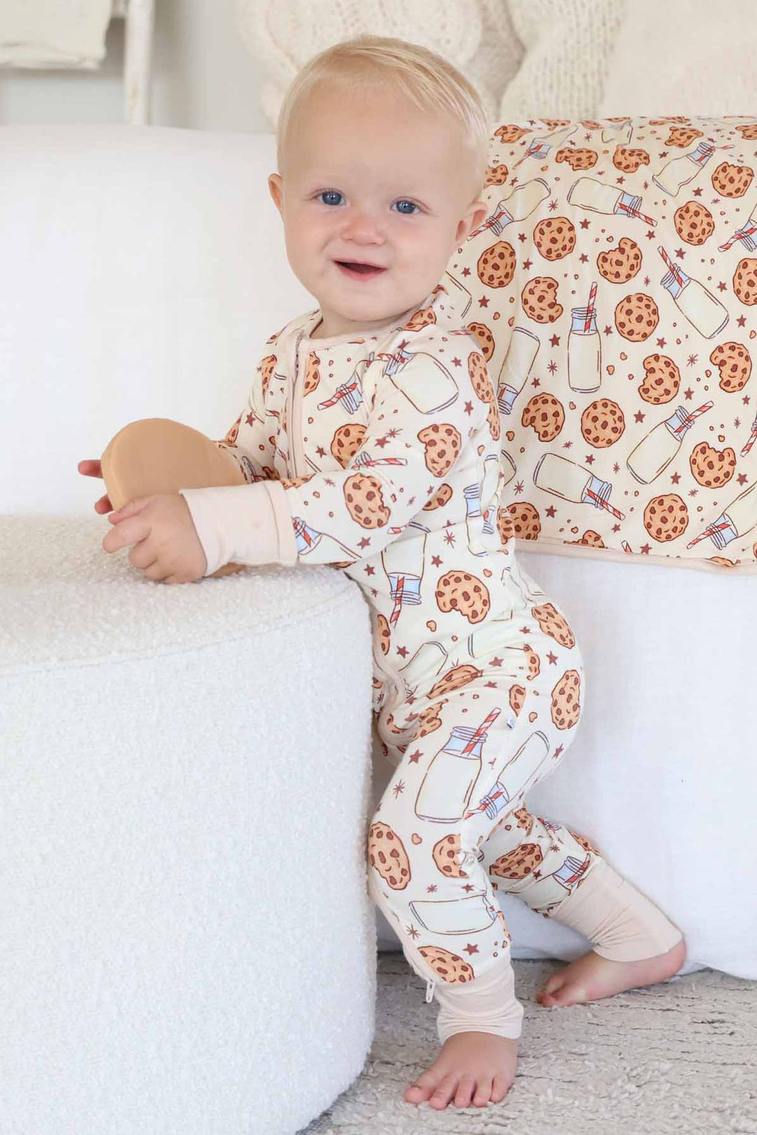 Baby wearing Cookie Cuddles Convertible Zip Romper while standing
