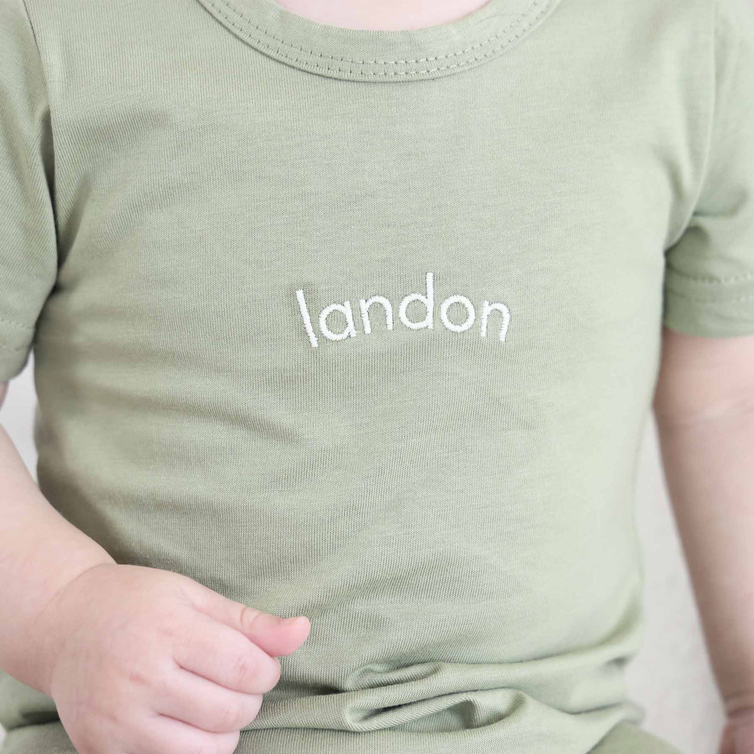 green baby and toddler embroidered cotton romper