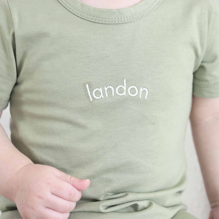 green baby and toddler embroidered cotton romper