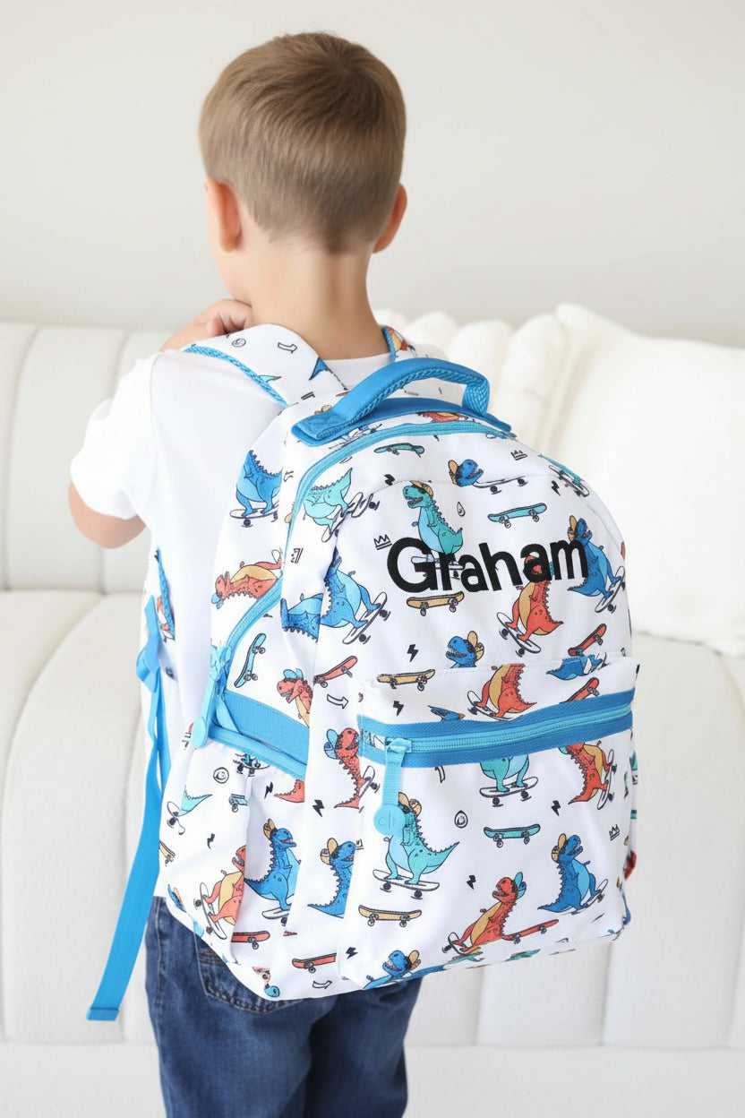 skateboarding dinosaur embroidered name backpack for boys 