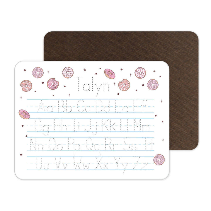 whiteboard personalized with name and pink donuts 