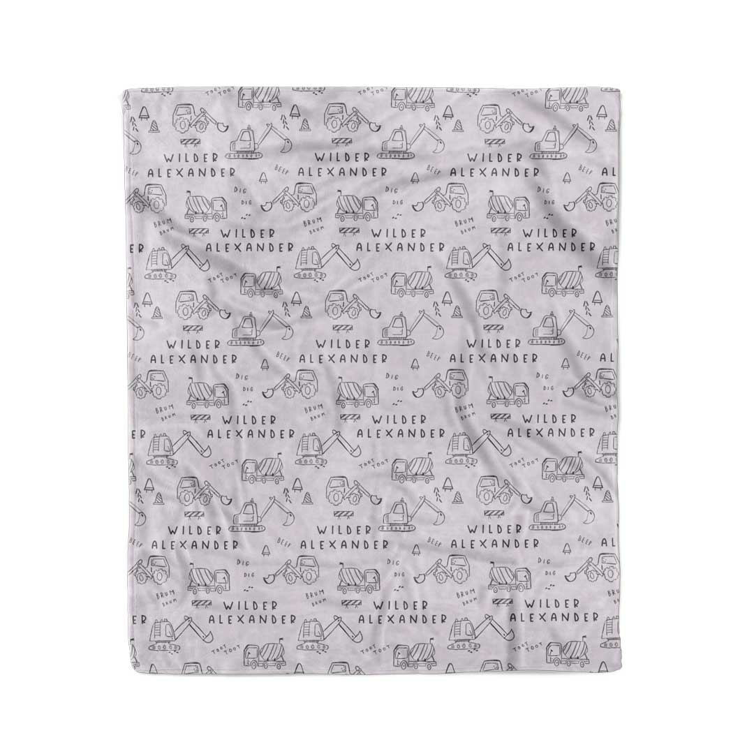 personalized kids blanket with doodles of construction trucks