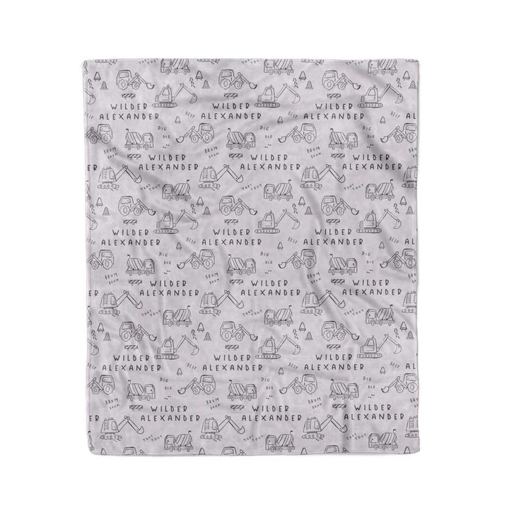 personalized kids blanket with doodles of construction trucks
