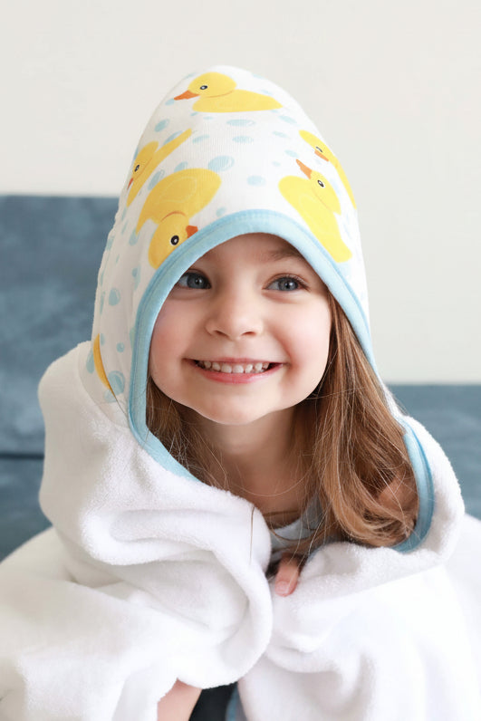 girl wrapped in rubber duck hooded towel