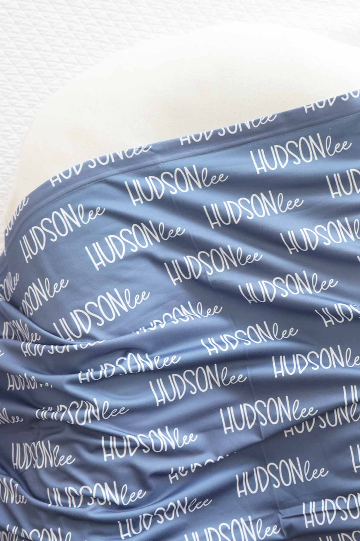 dusty blue personalized baby name swaddle blanket 