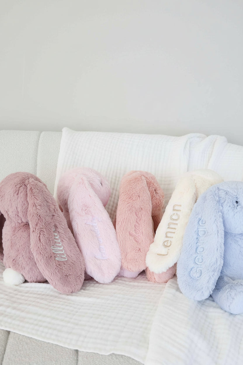 large cuddle plush bunnies with embroidered ear purple, pink, white and blue