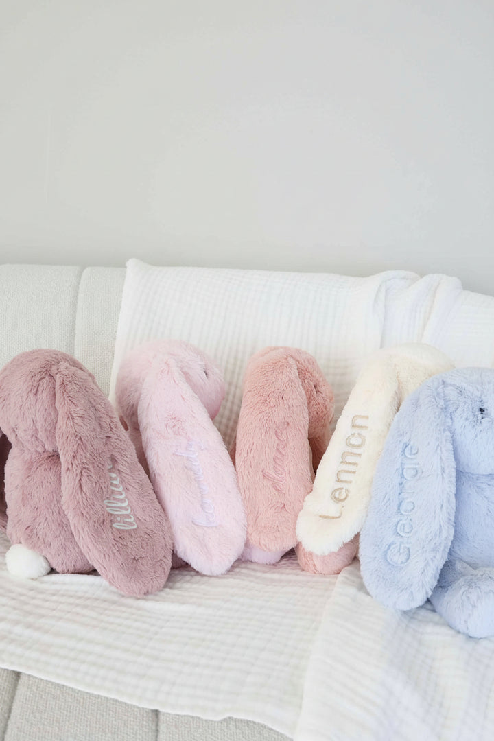 large cuddle plush bunnies with embroidered ear purple, pink, white and blue
