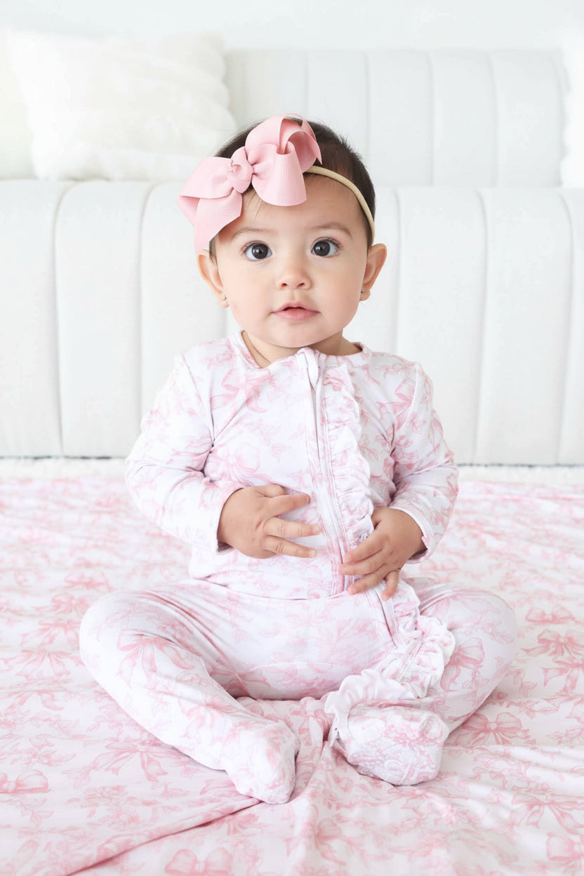 pink and white bow and floral ruffle zipper footie for baby girls