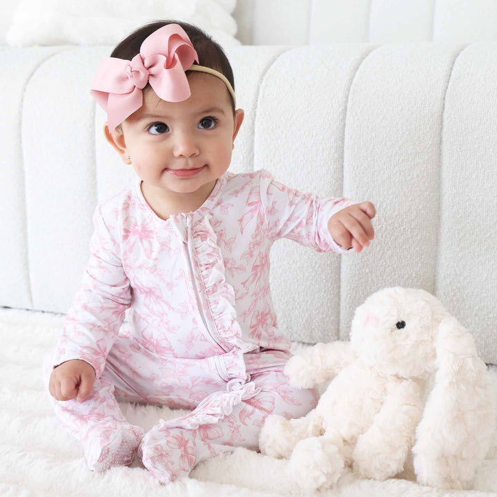 baby girl ruffle zipper footie pink and white bow toile print 