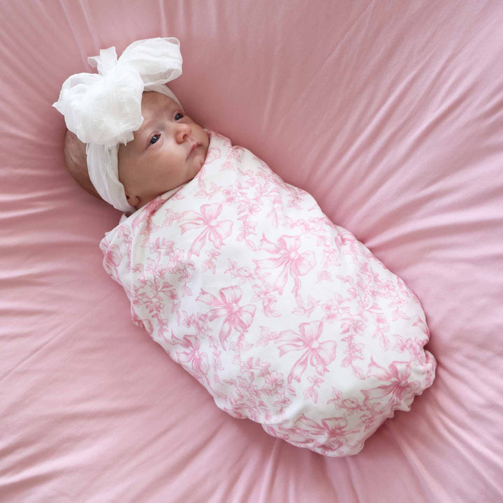 fancy frills pink and white oversized bamboo swaddle blanket for newborn girls 