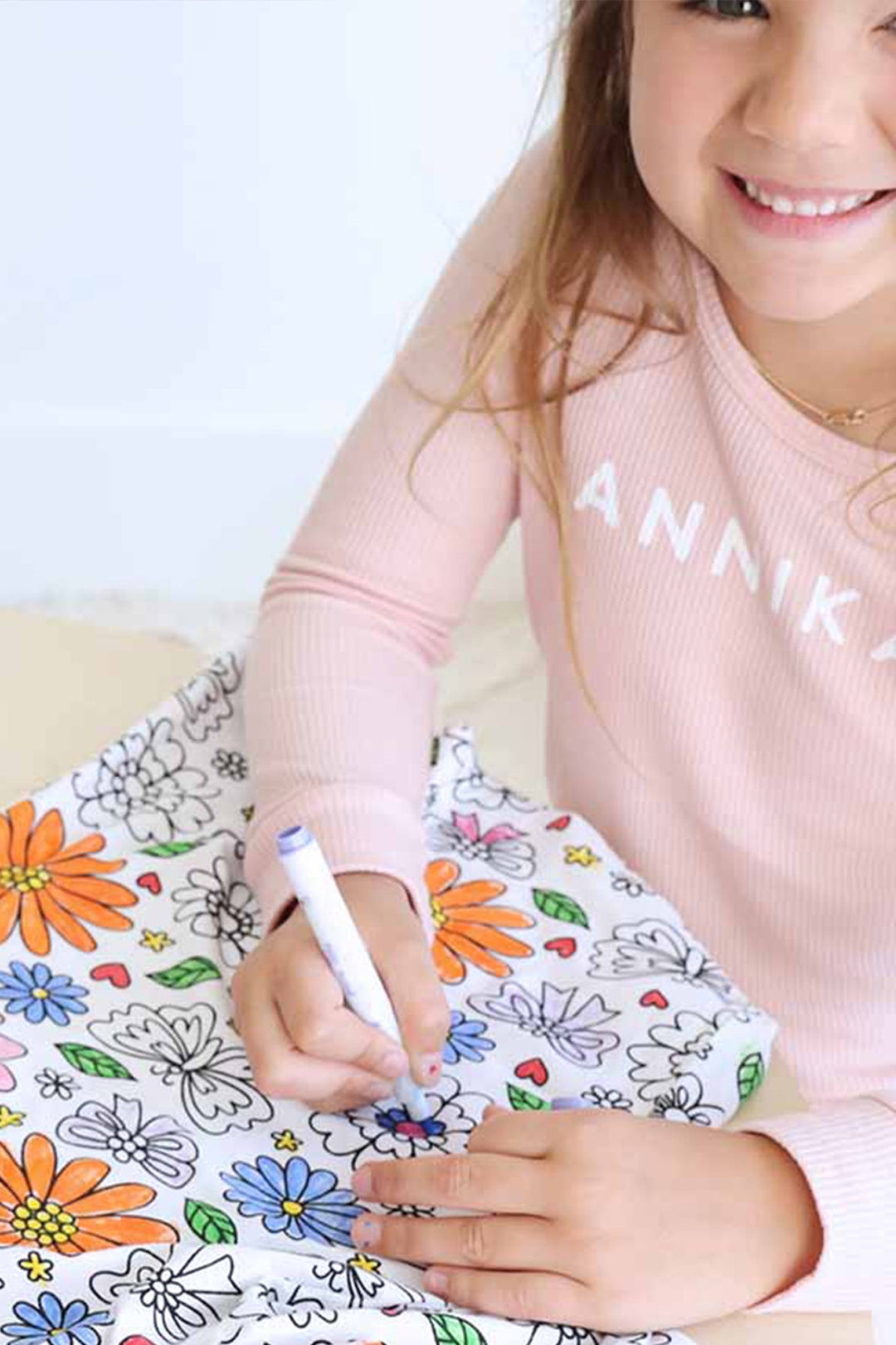 Little girl coloring the Colorable Two Piece Pajama Set | Floral Flutter