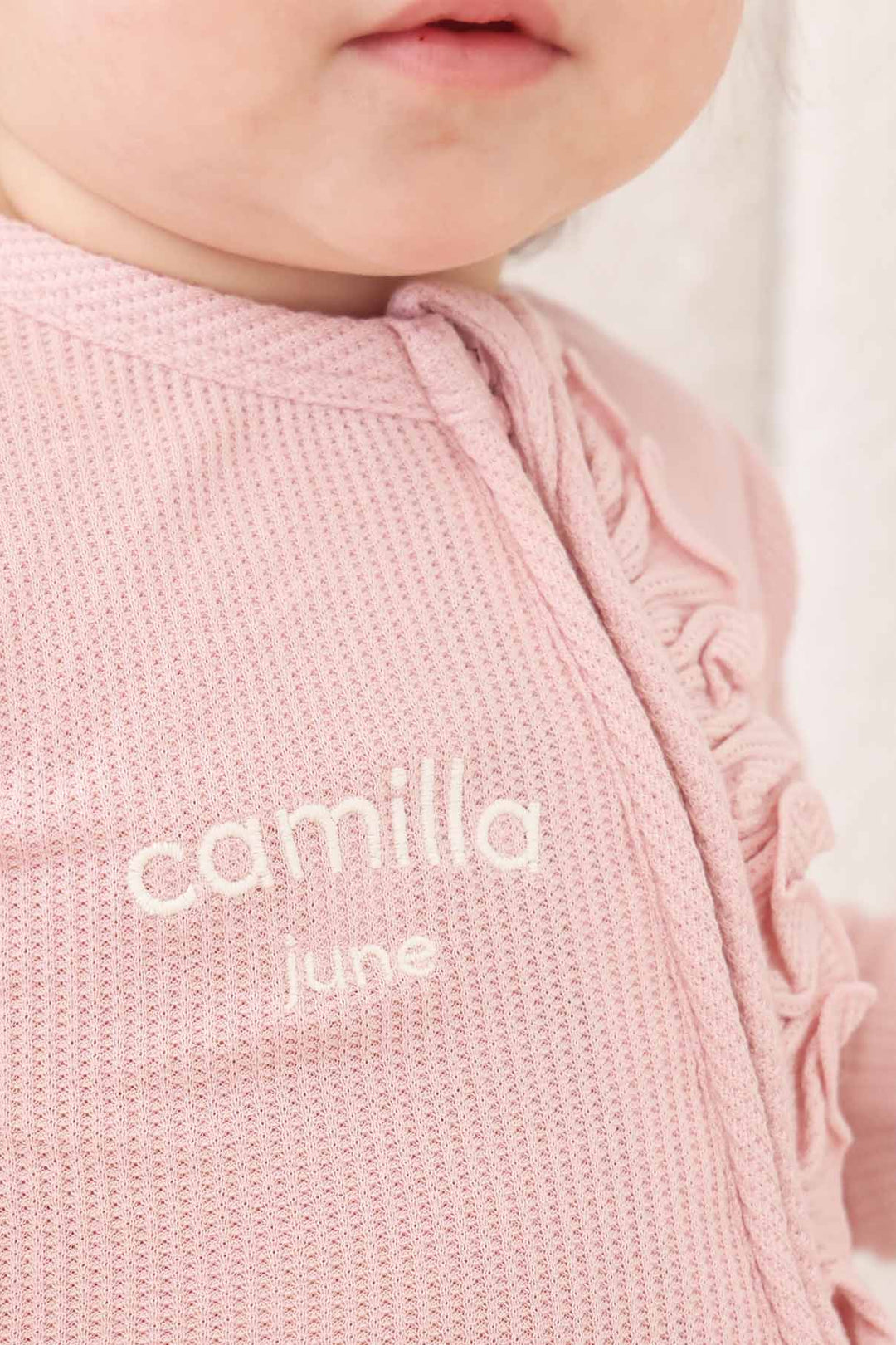 light pink bamboo waffle embroidered baby footie with ruffles 