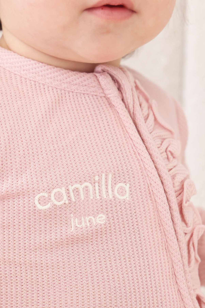 light pink bamboo waffle zipper ruffle footie for baby girls embroidered with name 