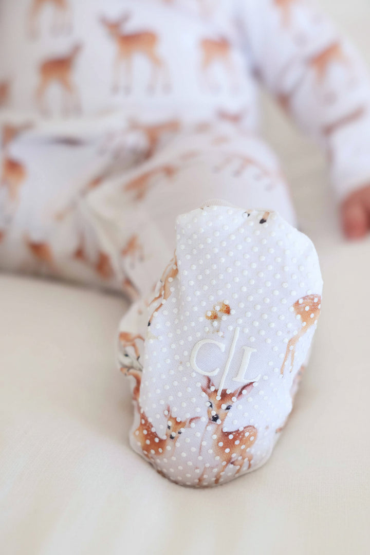 fawn baby zipper footie with grippers on the feet
