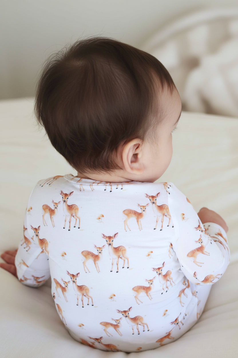 white baby zipper footie with fawn