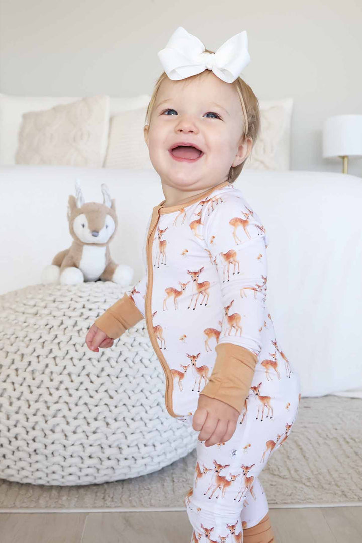 fawn and mushroom neutral zip romper pajama for baby and toddler girls 