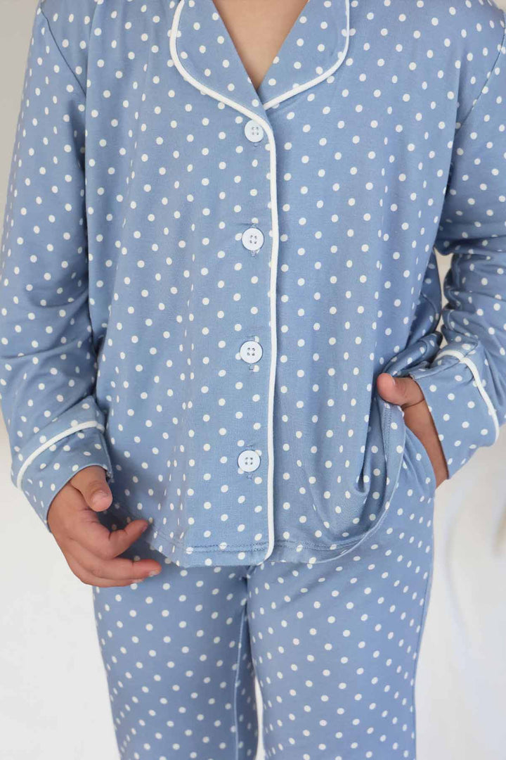 closeup shot of dusty blue girl's long sleeve lounge set with white polka dots made of bamboo viscose 