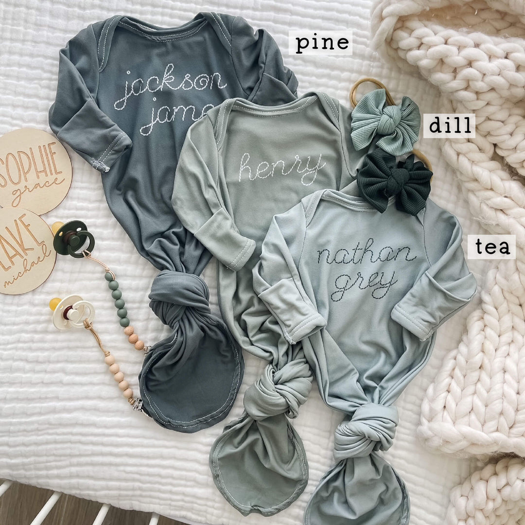 green stitched knot gown for babies