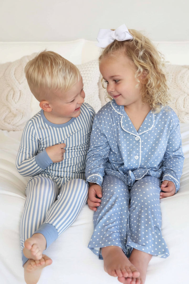 sibling matching pajamas for boy and girl. blue and white stripes and blue and white polka dots.